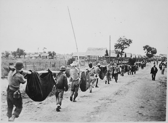 Photograph_of_American_Prisoners_Using_Improvised_Litters_to_Carry_Comrades,_05-1942_-_NARA_-_535564.jpg
