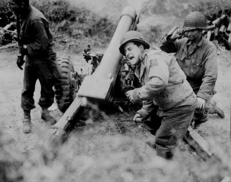 American howitzers shell German forces retreating near Carentan, France.jpg